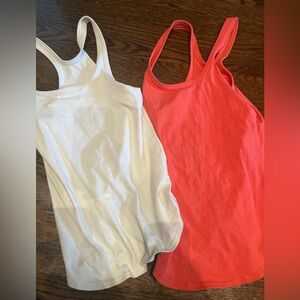 Two Lululemon White and Coral Tank Tops